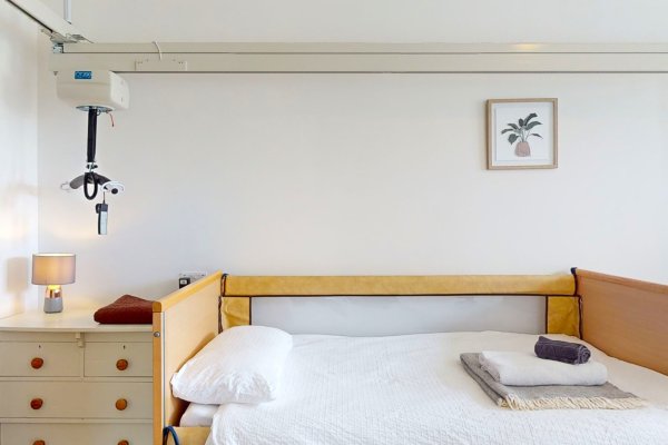 5_Schoolhouse Fenwick-ground floor accessible bedroom with an electric profiling bed and ceiling hoist