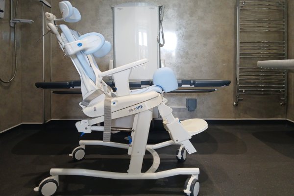 9_Rifton HTS shower chair-tilt in space with head rest, chest harness and pummel